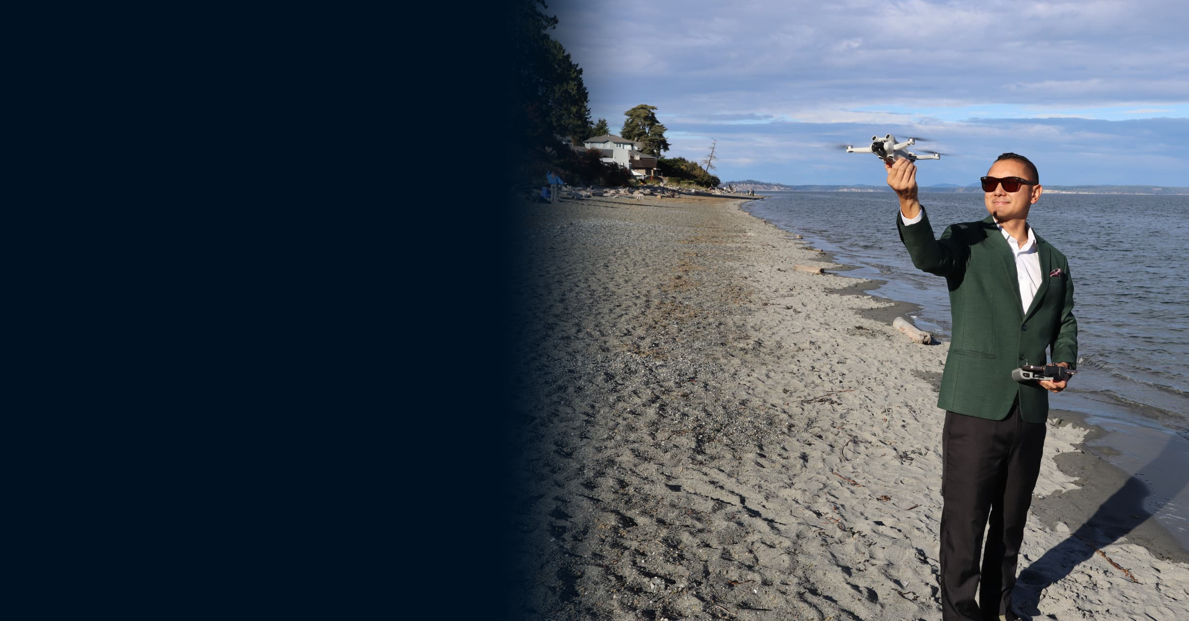 Randy Loo launching a drone on the Victoria shoreline